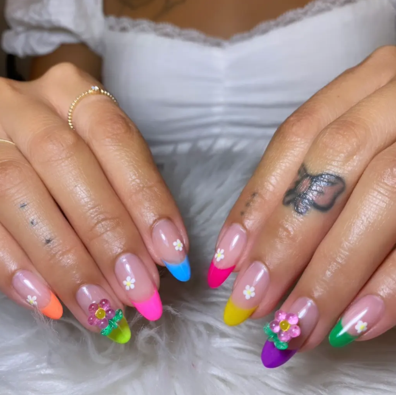 Colorful french tips with 3D flower accents